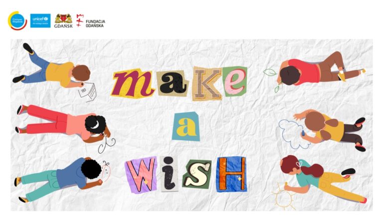 Grafika przedstawia napis make a wish którego litery są różnego kształtu i koloru, po obu stronach obrazka leży na brzuchu troje dzieci zajętych zabawą i rysowaniem.
